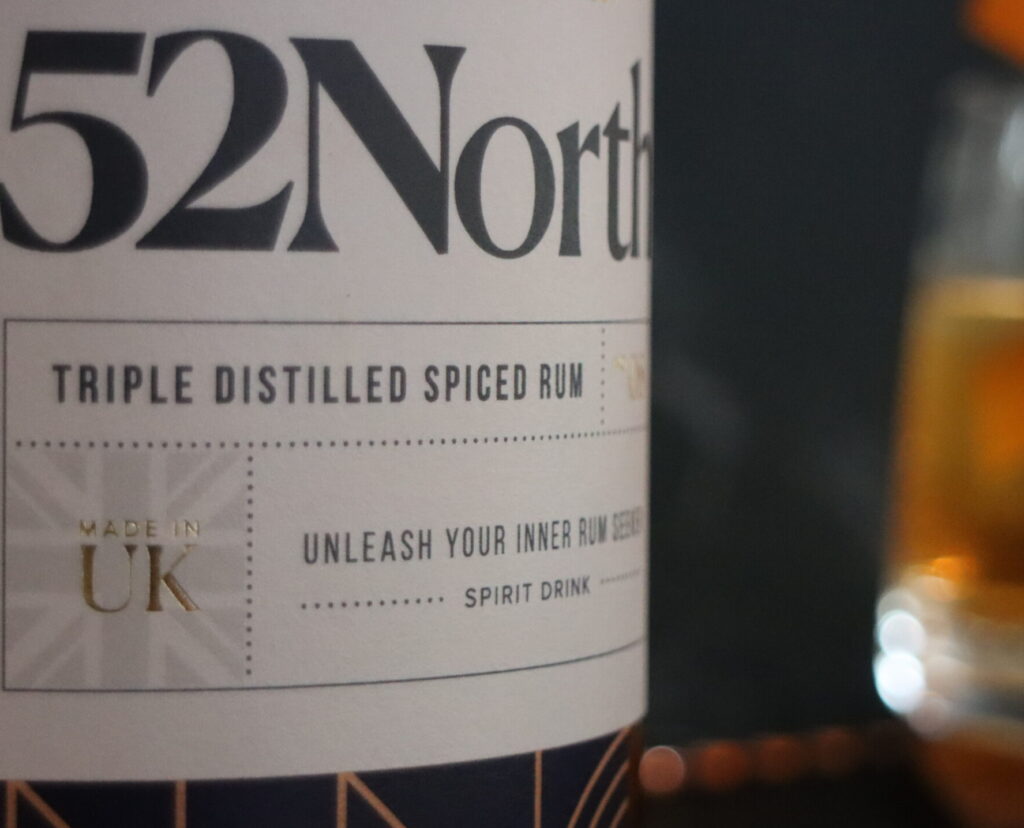 A closeup of a 52North Spiced Rum bottle.